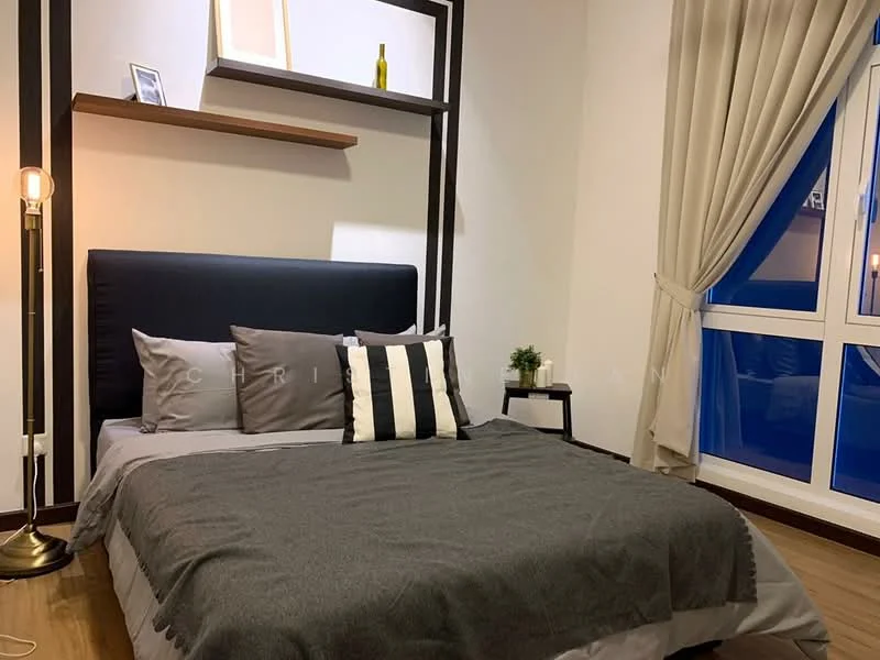 Bedroom features: king-size bed with dark upholstered headboard, grey bedding with decorative pillows, wooden flooring, floor lamp with gold base, shelf above bed with decorative items, large window with sheer curtains, striped throw pillow, wall-mounted decor, neutral wall color; style: modern.