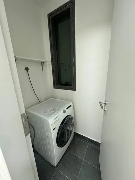 Laundry features: front-load washing machine, grey tiled flooring, white painted walls, shelf above washing machine, small window, door with handle.