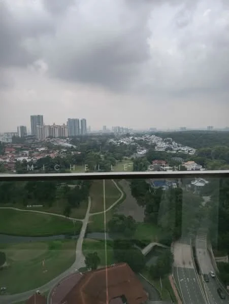 Exterior type: high-rise condominium; features: city skyline view, green landscape, golf course, roadway visible, multi-storey buildings in background, cloudy sky; style: modern.