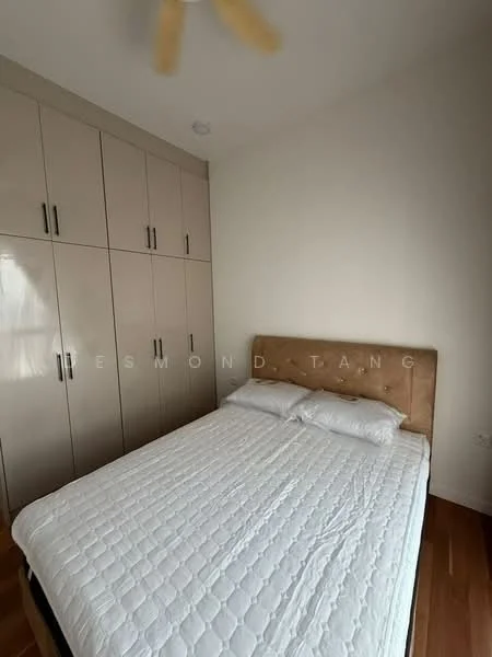 Bedroom features: queen-size bed with upholstered headboard, white bedding, built-in wardrobe with glossy cream finish, wooden flooring, ceiling fan, wall-mounted light fixture, neutral wall color, window with natural light; style: modern.