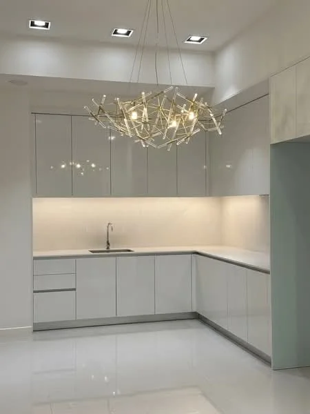 Kitchen features: white high-gloss cabinetry, marble countertop, single-bowl stainless-steel sink, chrome pull-down faucet, recessed LED downlights, modern chandelier, white tiled backsplash, polished ceramic tile flooring; style: modern.