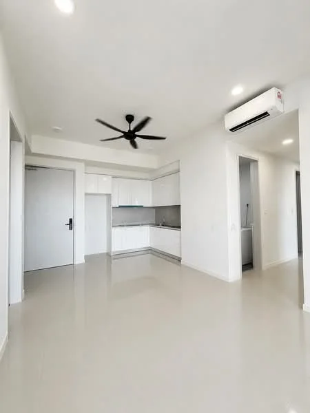 Living features: white painted walls, glossy tile flooring, 5-blade ceiling fan with light, wall-mounted split AC, kitchen area with white cabinetry, grey countertop, stainless-steel sink, recessed downlights, open layout, door leading to hallway; style: modern.