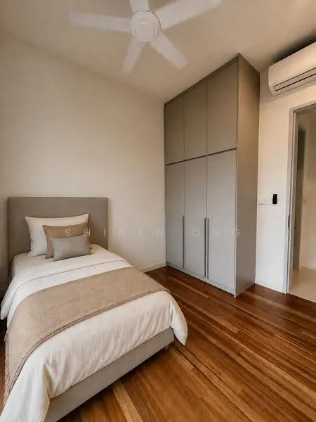 Bedroom features: single bed with beige bedding, upholstered headboard, wooden flooring, built-in wardrobe with grey doors, ceiling fan, wall-mounted air conditioning unit, neutral painted walls, decorative throw pillows; style: modern.