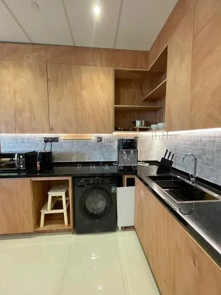 Kitchen features: wood cabinetry, black granite countertop, stainless-steel sink, chrome pull-down faucet, built-in washing machine, microwave, black toaster, black coffee machine, open shelving, tile backsplash, white ceramic plates, kitchen utensils, stool, recessed downlights; style: modern.