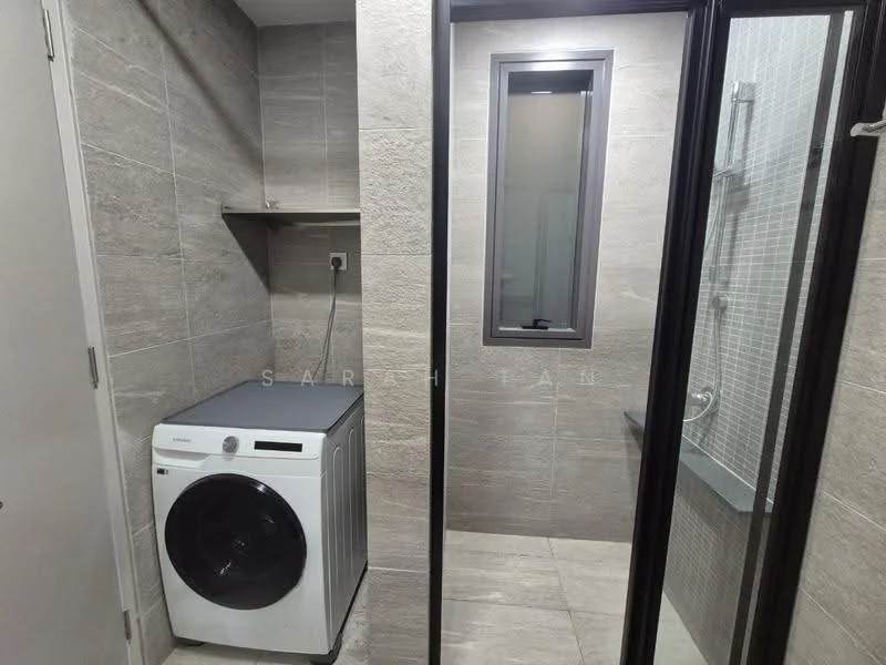 Laundry features: front-load washing machine, grey countertop, grey tiled walls, grey tiled flooring, glass shower enclosure, shower with wall tiles, small window, shelf above washing machine; style: modern.