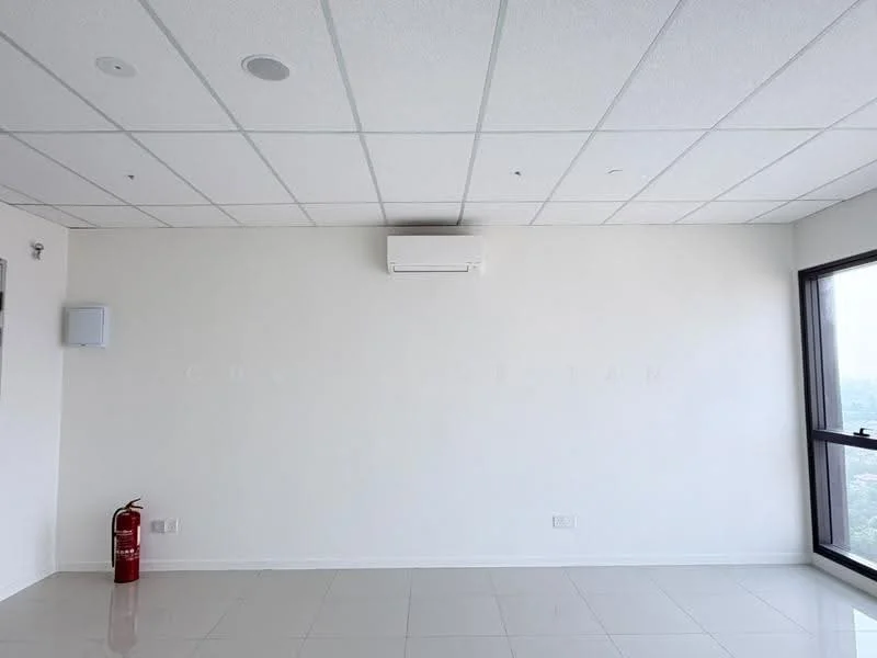 Room features: white painted walls, ceiling with acoustic tiles, 1 wall-mounted split AC, large window, glossy tile flooring, fire extinguisher, light fixtures, no visible furniture; style: modern; view: city.