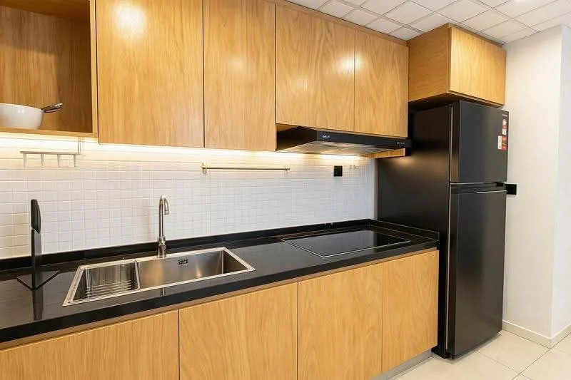Kitchen features: wood cabinetry, black granite countertop, single-bowl stainless-steel sink, chrome pull-down faucet, built-in stove, black refrigerator, white tiled backsplash, under-cabinet lighting, ceramic tile flooring; style: modern.