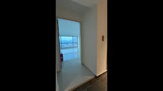 Room features: white painted walls, large floor-to-ceiling windows, tile flooring, neutral color scheme, doorway leading to another room, visible city skyline through windows; style: modern; view: city.