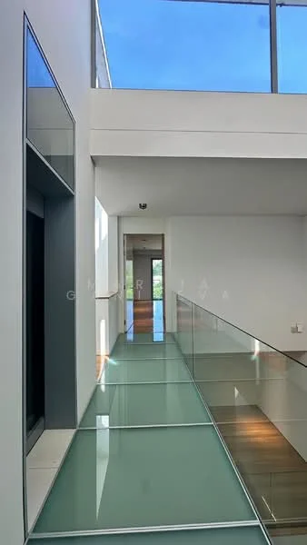 Room features: glass railing, wood flooring, white painted walls, large windows, natural light, open layout, glass floor panels, high ceiling; style: modern; view: sky.