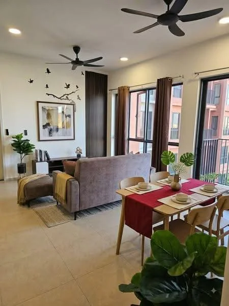 Living features: 3-seater fabric sofa in grey, 2 ceiling fans, wooden dining table with 4 chairs, decorative wall art, floor-to-ceiling windows, sheer curtains, area rug, indoor plants, wood paneling on wall, dining table set with plates and cutlery; style: modern.