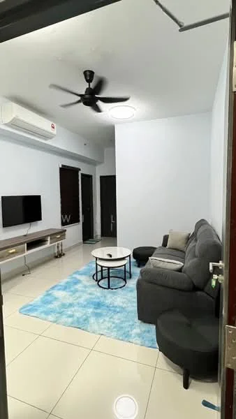 Living features: grey fabric L-shape sectional sofa, round coffee table with black metal frame, area rug with blue pattern, wall-mounted TV, TV console with wooden surface, 1 wall-mounted split AC, ceiling fan with light, white painted walls, glossy tile flooring, black ottoman, window with dark blinds; style: modern.