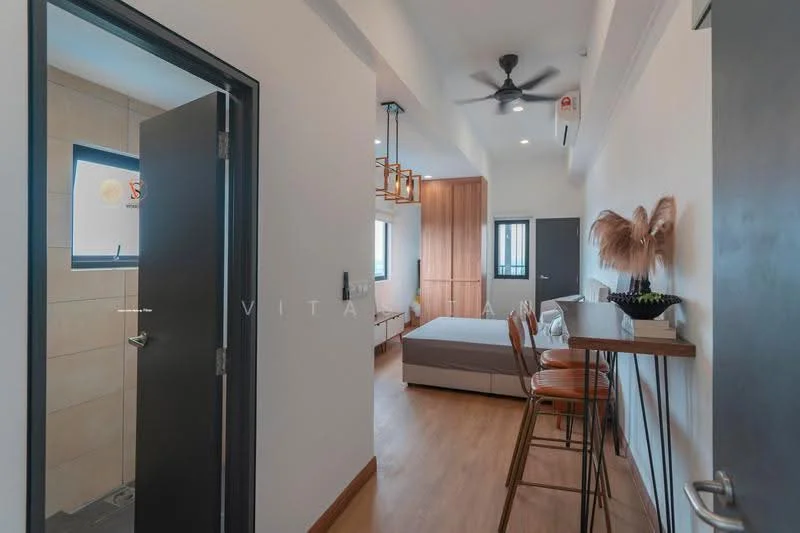 Room features: wooden flooring, white painted walls, ceiling fan, window with view, bed with grey upholstered headboard, bar counter with stools, wood cabinetry, door leading to bathroom, light fixture with multiple bulbs, decorative plant, air conditioning unit; style: modern.