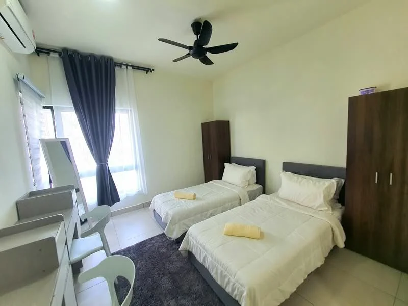 Bedroom features: two single beds with white bedding, black upholstered headboards, grey bed frames, white walls, ceiling fan, large window with sheer curtains, dark grey area rug, two wooden bedside cabinets, white study desk with chair, wall-mounted mirror; style: modern.
