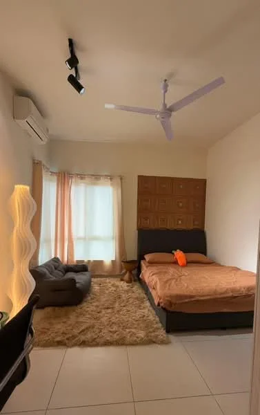 Bedroom features: king-size bed with brown bedding, upholstered headboard, 2 bedside lamps, floor-to-ceiling window with sheer curtains, light brown area rug, ceiling fan with light, wall-mounted air conditioning unit, decorative wall paneling, bean bag chair, track lighting; style: modern.