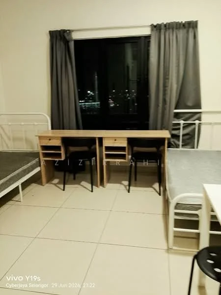 Bedroom features: two single beds with metal frames, grey bedding, two study desks with drawers, two black chairs, floor-to-ceiling window, grey curtains, white walls, tile flooring; style: modern; view: city.