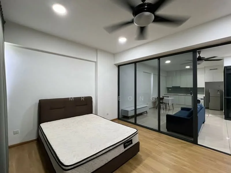 Bedroom features: queen-size bed base without mattress, 5-blade ceiling fan, wooden flooring, white painted walls, floor-to-ceiling glass windows, curtains, built-in wardrobe, natural light from windows; style: modern. Living features: sofa in blue fabric, dining table with chairs, open-plan layout, kitchen area visible, white cabinetry, stainless-steel fridge, ceramic tile flooring; style: modern.