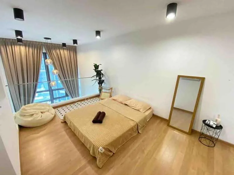 Bedroom features: queen-size bed with beige bedding, wooden flooring, floor-to-ceiling windows, sheer curtains, recessed downlights, decorative mirror, bean bag chair, small side table, indoor plant, area rug with geometric pattern; style: modern; view: city.