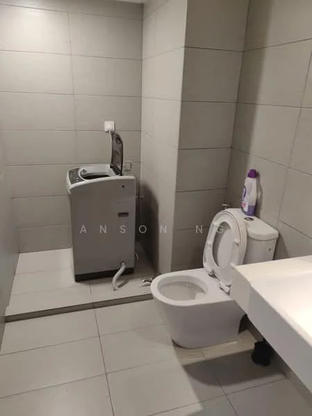 Bathroom features: grey tiled walls, white ceramic floor tiles, toilet, front-load washing machine, sink with countertop, wall-mounted faucet, soap dispenser, washing machine hose, light fixture; style: modern.