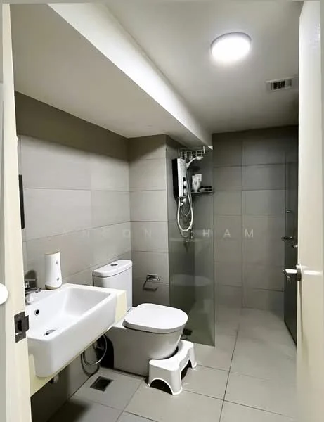 Bathroom features: grey tiled walls, grey tiled flooring, single-sink vanity with white cabinet, chrome basin mixer faucet, one-piece toilet, walk-in shower with glass enclosure, handheld shower, ceiling light, mirror above sink, towel rack; style: modern.