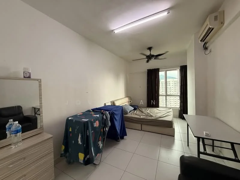 Room features: white painted walls, tile flooring, 1 ceiling fan, floor-to-ceiling window, blackout curtains, 1 air conditioning unit, 1 mirror, 1 table, 1 black leather sofa, bed with mattress, blue bed sheet with pattern, water bottles on table; style: minimalist; view: city.
