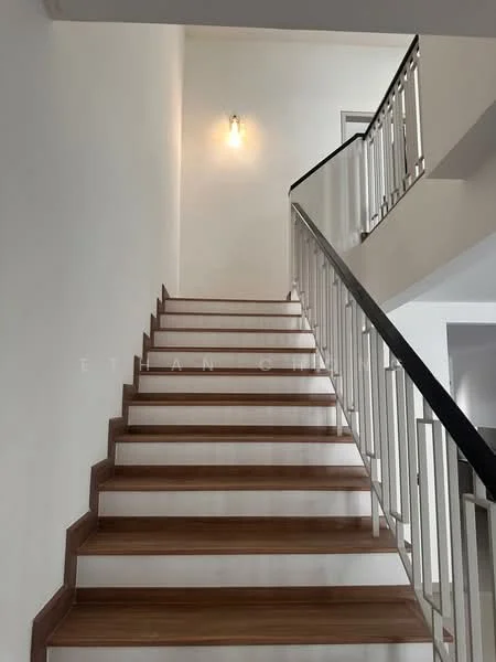 Room features: wooden staircase, white painted walls, metal railing with vertical bars, wall-mounted light fixture; style: modern.
