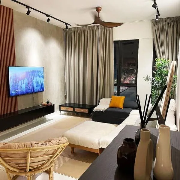 Living features: sofa in dark grey fabric, coffee table, TV console, wall-mounted TV, 5-blade ceiling fan with light, floor-to-ceiling windows, sheer curtains, decorative plants, area rug, wood accent wall, recessed lighting, decorative vases; style: modern; view: city.