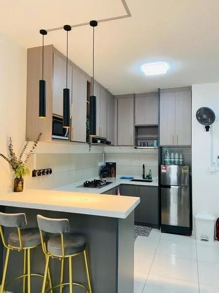 Kitchen features: grey cabinetry, white countertop, stainless-steel fridge, built-in gas stove, black pendant lights, white tiled backsplash, white tiled flooring, bar seating with two stools, wall-mounted fan, open shelving, decorative vase with flowers; style: modern.