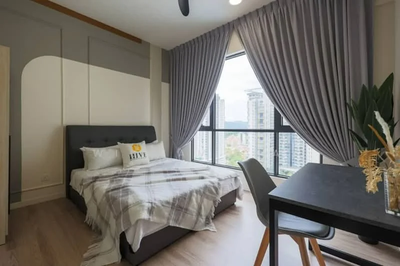 Bedroom features: king-size bed with upholstered headboard, plaid throw blanket, two decorative pillows, floor-to-ceiling windows, grey curtains, wooden flooring, study desk with chair, indoor plant, wall-mounted decor, neutral wall color; style: modern; view: city.