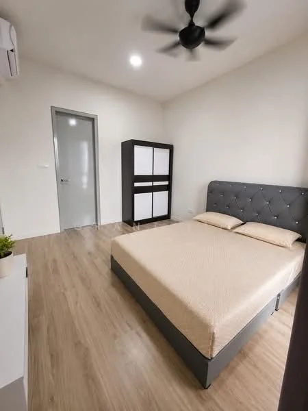 Bedroom features: queen-size bed with beige bedding, upholstered headboard in grey, wooden flooring, 5-blade ceiling fan, wall-mounted split AC, built-in wardrobe with white and grey panels, neutral painted walls, door with grey frame, window with sheer curtains, decorative plant on bedside table; style: modern.