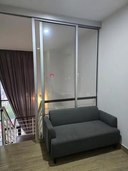 Room features: grey fabric sofa, glass sliding door, wooden flooring, curtains in dark grey, staircase visible in background, neutral wall color; style: modern; view: city.