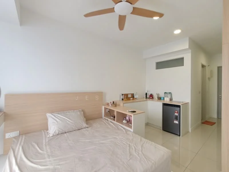 Bedroom features: queen-size bed with light-colored bedding, wooden headboard, ceiling fan, white painted walls, glossy tile flooring, built-in shelving unit, small refrigerator, kettle, countertop with storage, doorway leading to bathroom, window with natural light; style: modern.