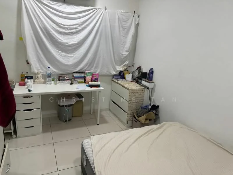 Bedroom features: white painted walls, tile flooring, single bed, bedside table, desk with drawers, books on desk, water bottle, storage box, cluttered surface, window covered with white fabric.