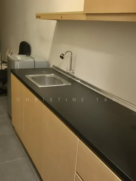 Kitchen features: single-bowl stainless-steel sink, chrome pull-down faucet, black countertop, light wood cabinetry, grey tile flooring, built-in washing machine, under-cabinet lighting; style: modern.