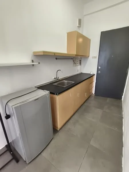 Kitchen features: single-bowl stainless-steel sink, chrome pull-down faucet, black countertop, light wood cabinetry, open shelving, grey fridge, tile flooring, white walls, door, wall-mounted storage, under-cabinet lighting; style: modern.