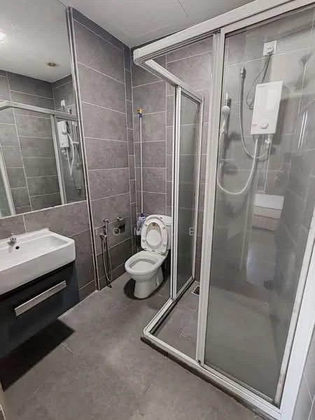 Bathroom features: grey tiled walls, grey tiled flooring, single-sink vanity with dark cabinet, chrome basin mixer faucet, framed mirror above sink, one-piece toilet, walk-in shower with glass enclosure, shower head with handheld shower, wall-mounted water heater, recessed lighting; style: modern.