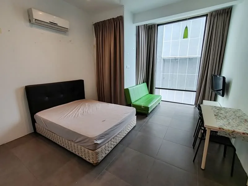 Room features: queen-size bed with black upholstered headboard, green sofa, white desk with chair, wall-mounted TV, floor-to-ceiling window, curtains, air conditioning unit, grey tile flooring; style: modern; view: city.