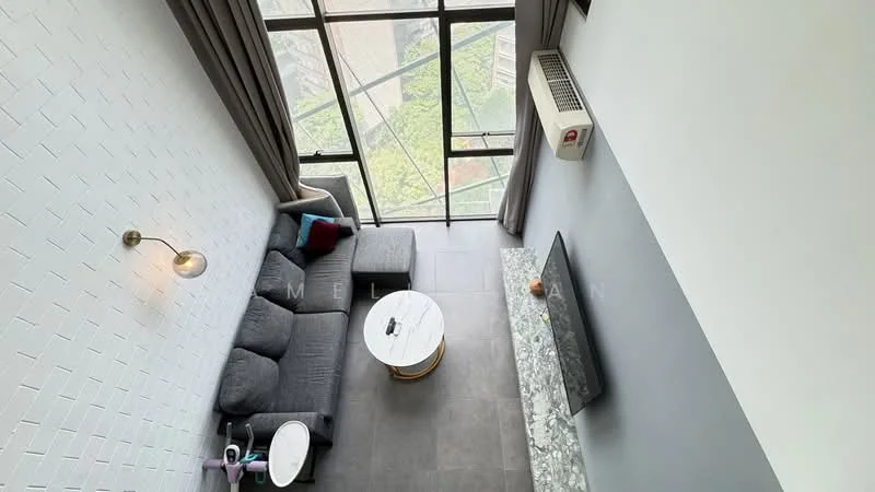 Living features: grey fabric sectional sofa, round coffee table with marble top, wall-mounted TV, exposed brick accent wall, large floor-to-ceiling windows, curtains, air conditioning unit, decorative wall sconce, grey tiled flooring; style: modern; view: garden.