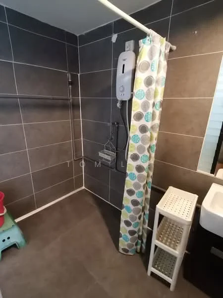 Bathroom features: grey tiled walls, dark grey tiled flooring, shower area with curtain, handheld shower head, wall-mounted water heater, white sink with cabinet, storage shelf, green plastic stool; style: modern.