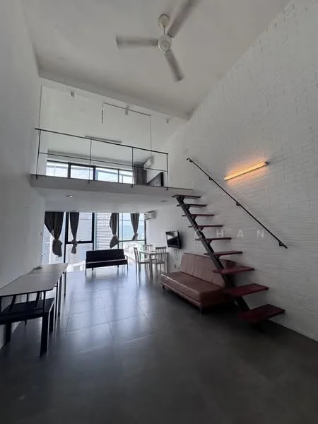 Living features: white painted walls, exposed brick wall, grey tile flooring, 5-blade ceiling fan, large windows with sheer curtains, sofa in dark color, dining table with chairs, staircase with wooden steps, wall-mounted light fixture; style: modern.