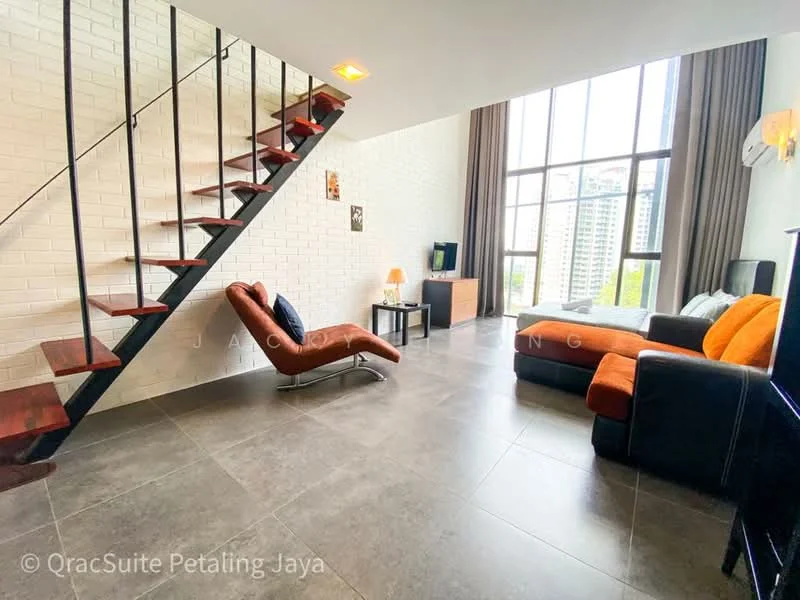 Living features: grey tiled flooring, white painted walls, large floor-to-ceiling windows, black leather sofa, orange fabric throw pillows, black TV console, wall-mounted TV, wooden coffee table, decorative wall art, recessed ceiling lights, air conditioning unit, curtains, staircase with wooden steps and black railing; style: modern; view: city.