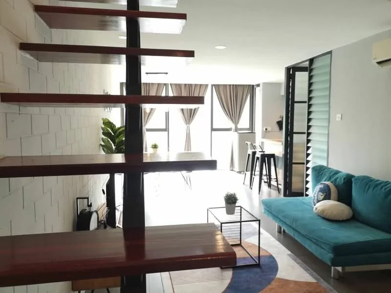 Living features: sofa in teal fabric, coffee table, area rug with circular pattern, floor-to-ceiling windows, curtains in light brown, wooden staircase with black metal railing, decorative plant in pot, wall-mounted air conditioning unit, wall with white painted bricks, light ceiling with recessed downlights; style: modern.