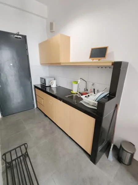 Kitchen features: black granite countertop, light wood cabinetry, single-bowl stainless-steel sink, chrome pull-down faucet, built-in microwave, electric kettle, dish rack, tile backsplash, grey ceramic tile flooring, wall-mounted chalkboard, waste bin; style: modern.