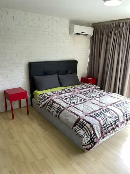 Bedroom features: queen-size bed with grey upholstered headboard, plaid patterned bedding, two red bedside tables, wooden flooring, white painted walls, air conditioning unit, floor-to-ceiling curtains, recessed ceiling light; style: modern.
