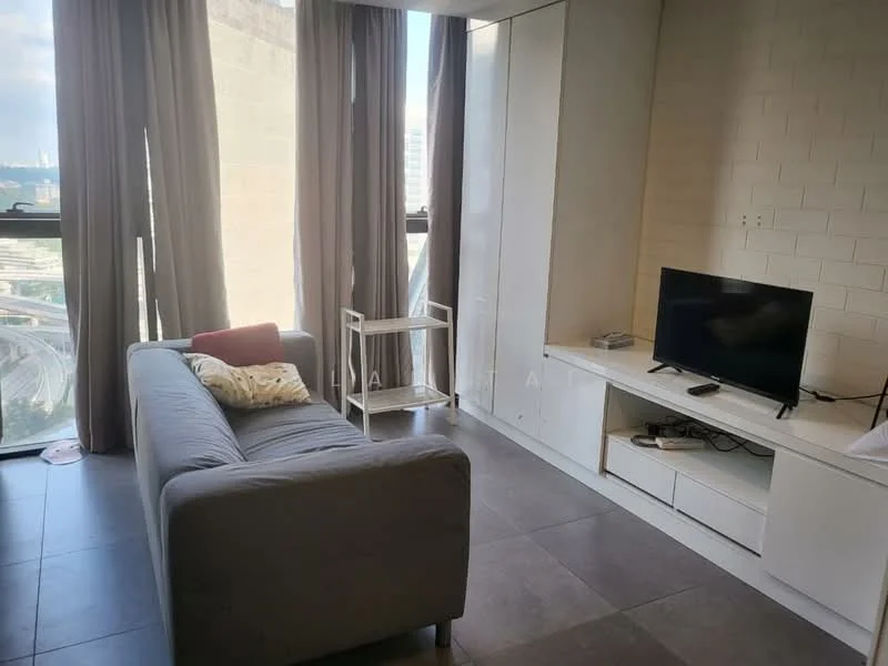 Living features: grey fabric sofa, throw pillow, white TV console, wall-mounted TV, floor-to-ceiling windows, sheer curtains, grey tiled flooring, light-colored wall, small side table; style: modern; view: city.