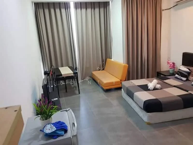 Room features: grey tiled flooring, white painted walls, floor-to-ceiling windows with sheer curtains, orange fabric sofa, black bed frame with checkered bedding, small dining table with two chairs, decorative plant on table, air conditioning unit on wall, light brown curtains; style: modern.