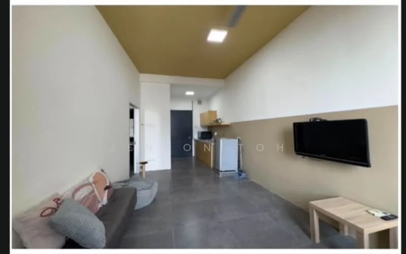Living features: grey fabric sofa, wooden coffee table, wall-mounted TV, light grey walls, cream accent wall, recessed ceiling lights, ceiling fan, kitchenette with wooden cabinetry, stainless-steel fridge, open layout, tile flooring; style: modern.