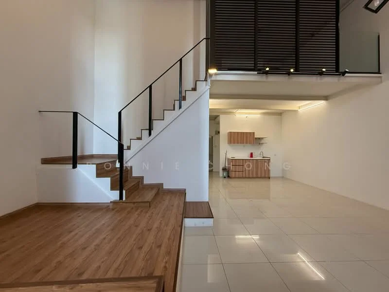 Living features: wooden staircase with black railing, open-plan layout, white painted walls, tile flooring, recessed lighting, kitchen area visible in background, large windows allowing natural light, wooden flooring at the lower level; style: modern. Kitchen features: kitchen cabinetry, countertop, appliances visible, open layout to living area; style: modern.