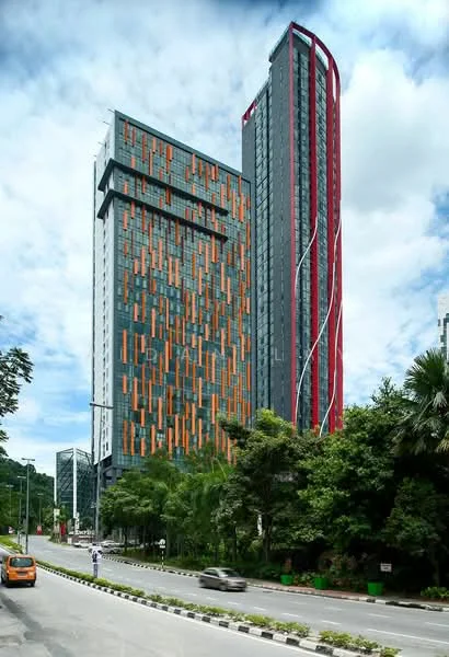 Exterior type: high-rise condominium; features: glass curtain wall, orange and grey facade, projecting balconies, vertical fins, surrounded by mature greenery, urban context with road access; style: modern.