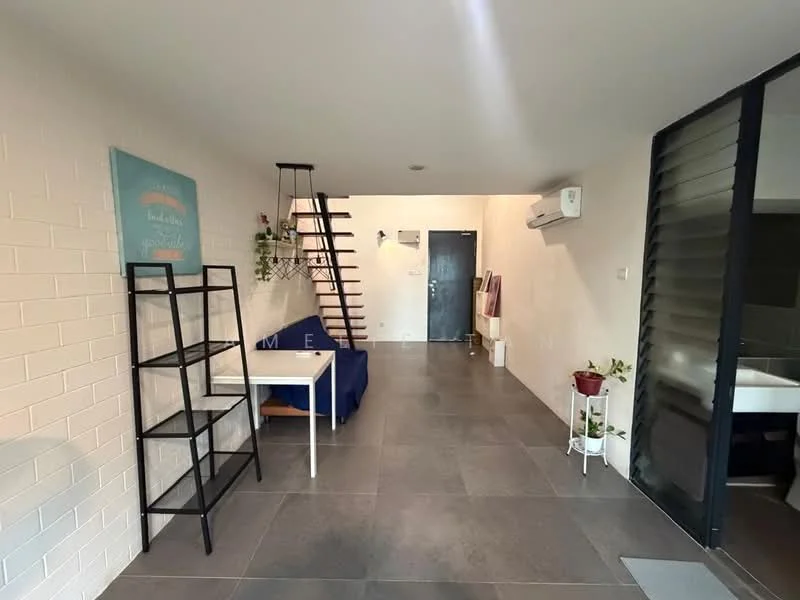 Room features: white painted walls, grey tile flooring, staircase with wooden steps, black metal shelving unit, blue fabric sofa, white table, wall-mounted air conditioning unit, door with glass panel, indoor plants, light fixture hanging from ceiling; style: modern.