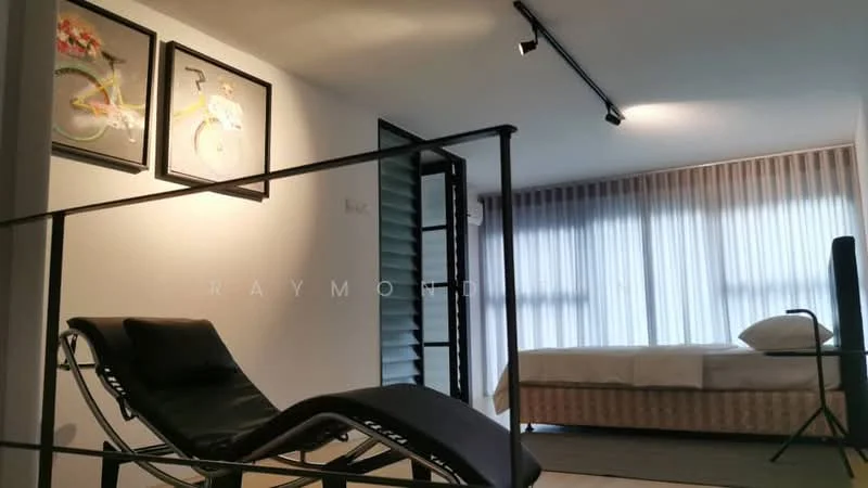 Room features: large windows with sheer curtains, wooden flooring, recessed downlights, black metal railing, framed artwork on walls, bed with white bedding, minimalist design, lounge chair, sliding door; style: modern.
